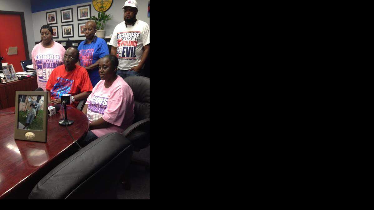 
Grieving family: Grandfather Harold Alexander and mother Adriane Alexander at the table Top row left to right, aunt Rachel McGett and grandmother Yvonne Alexander, with an anti-violence activist.
