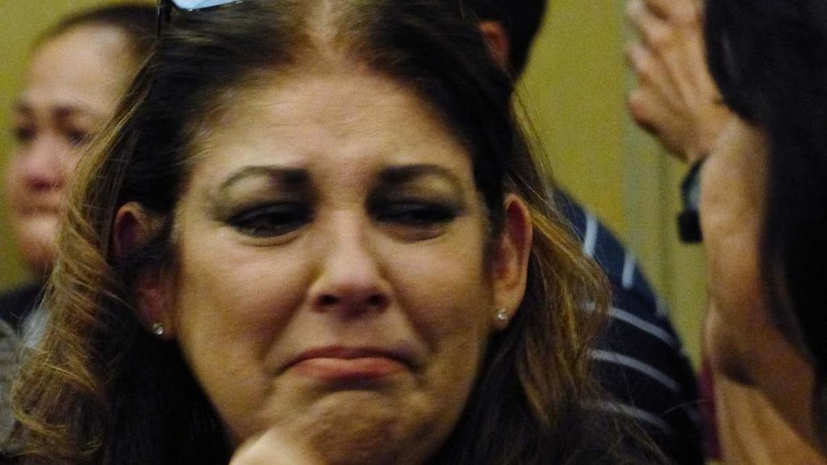 Marisel Yee, widow of Robert Yee, cries at Miami criminal court on Friday as the killer of her husband was sentenced to life in prison.