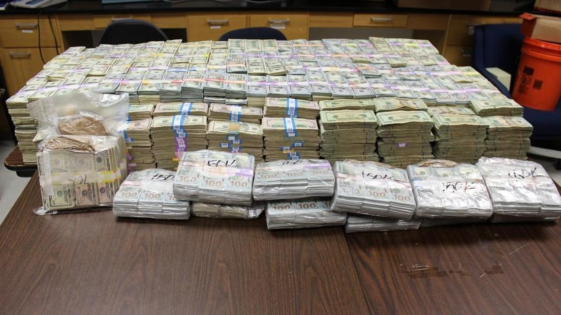 Cash seized from the Miami Lakes home of Luis Hernandez-Gonzalez. He is charged with money laundering and marijuana trafficking.
