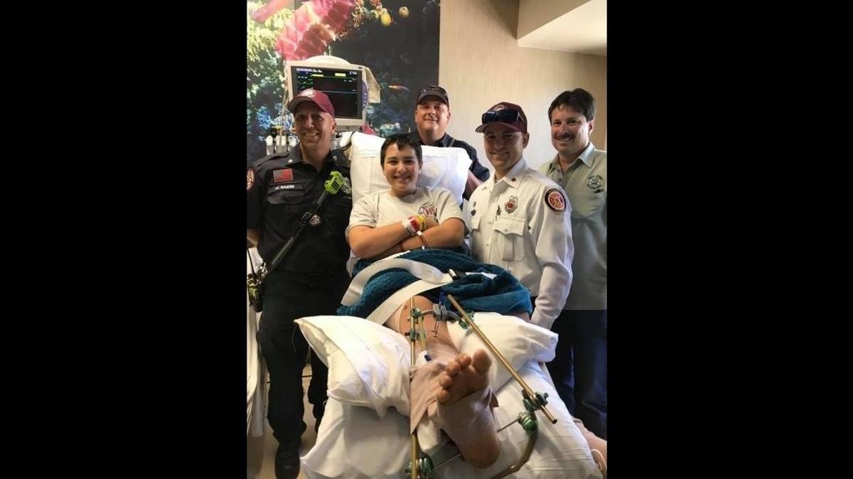 Parkland shooting victim Kyle Laman pictured here with members of Sunrise Fire Rescue following last month’s school shooting that left 17 dead and over a dozen injured.