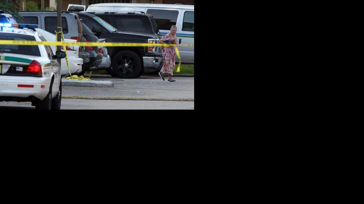 
The scene at the Courts of Birdwood apartments at Southwest 38th Street and 99th Avenue, where three people were shot Tuesday night. One died at the scene, one at the hospital and a third was injured. 
