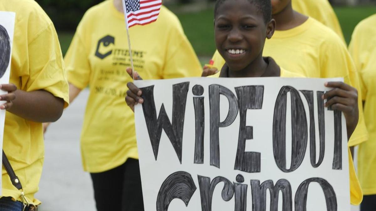 Ten-year-old Abdyus Thelusma was among about two dozen people who took part in the annual Citizens Crime Watch Celebrating Safe Communities walk in Ives Estates in 2011.