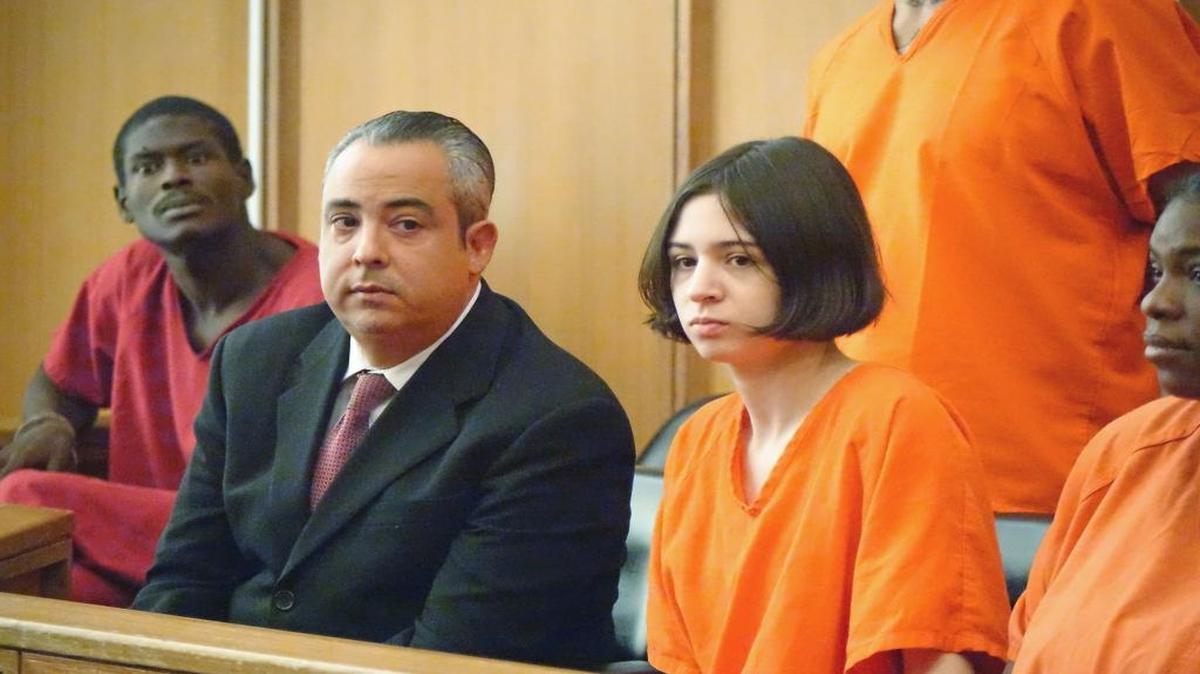 Marta San Jose, a former Miami foreign-exchange student charged with helping her husband molest her younger sister, appeared in court Thursday. Next to her is her defense lawyer, Jorge Viera.