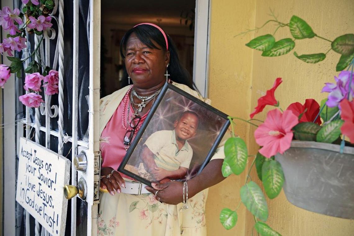 Della Wright with a portrait of her son Jerome Wright, as a young boy, at her home in Miami. She has been struggling to deal with her son's mental illness for decades before he was found with the mutilated remains of his girlfriend in their house.