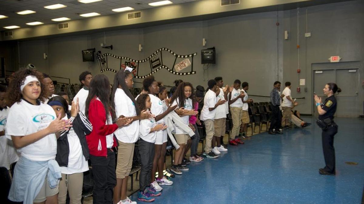 Officer Hilda Hernandez speaks to the students celebrating the end of the Gang Resistance Education and Training program (G.R.E.A.T.) at Cutler Bay Middle School in Cutler Bay.
