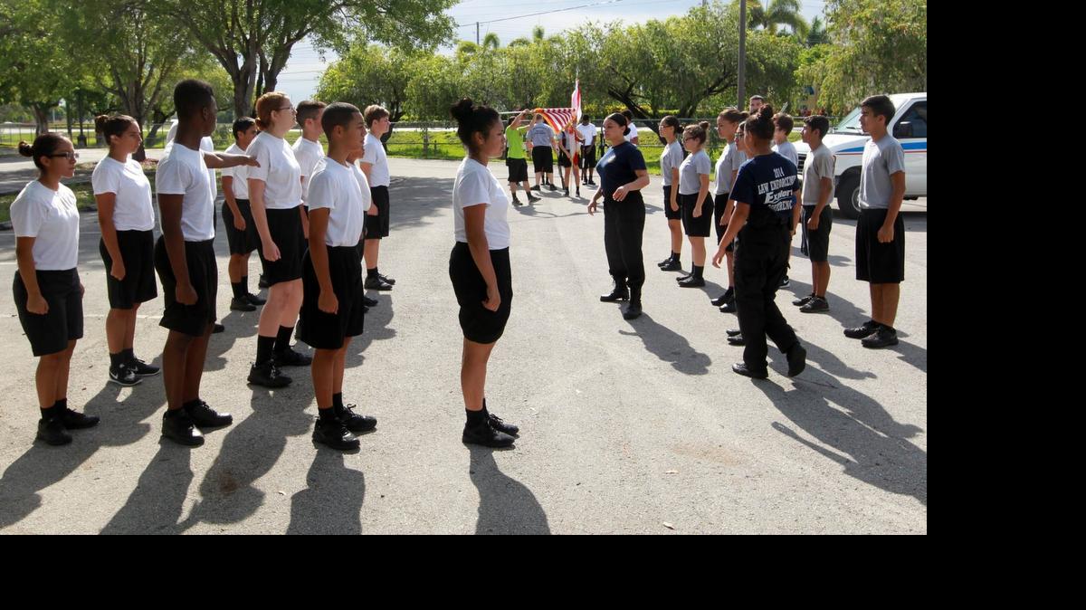 PREPARING THEM FOR THE WORLD:  The Homestead Police Explorers undergo physical training on June 6 as part of the police program that meets twice a week.