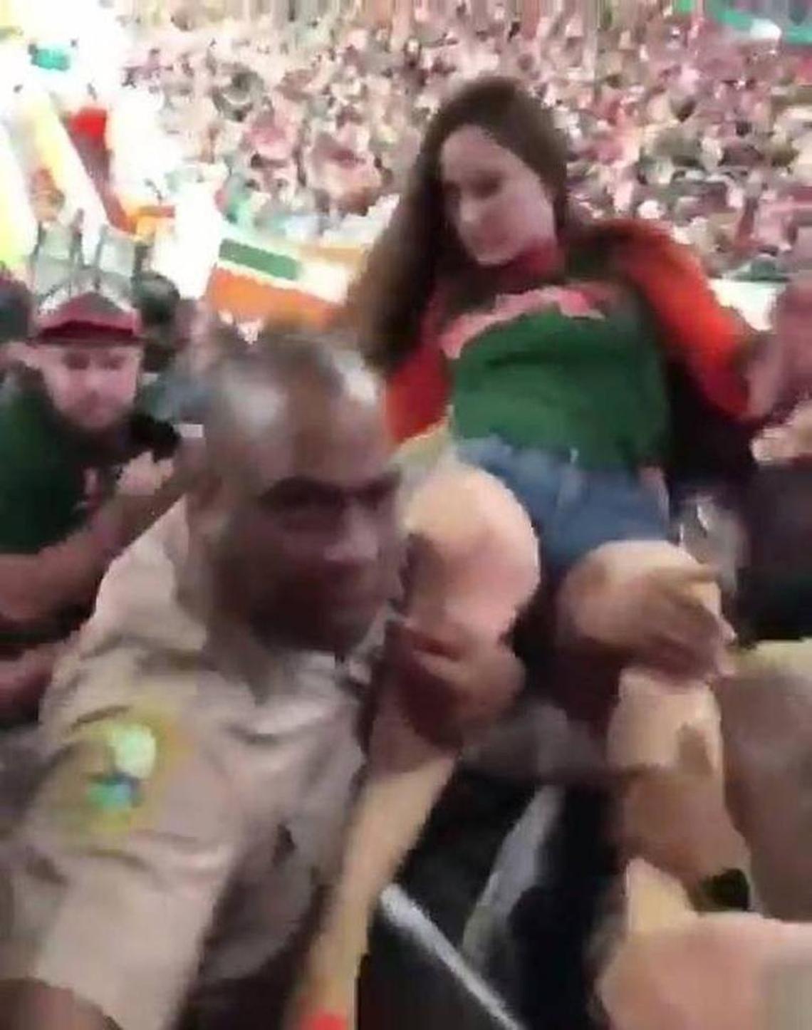 An Instagram video shows a Miami-Dade police officer striking a woman in the face while helping other cops ejecting her from a University of Miami win against Virginia Tech earlier this month. Miami-Dade police supervisors reviewed the actions of Officer Douglas Ross, left, and found he violated no department rules.