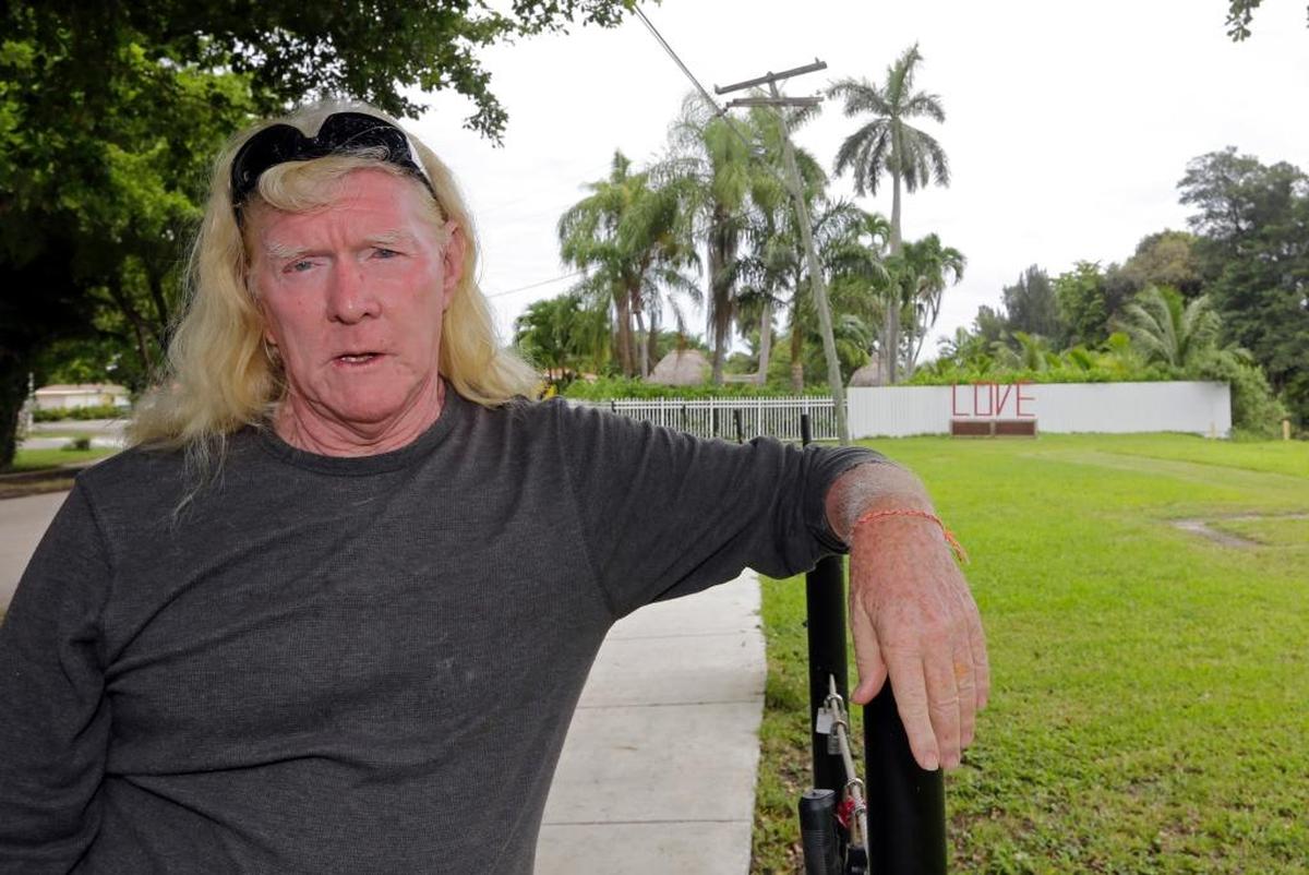 In this Aug. 11, 2016, photo, Mickey Munday talks to a reporter in Love Park in North Miami, Fla. Federal prosecutors want to use Munday’s past as a cocaine cowboy against him during an upcoming trial on charges of participating in an auto fraud ring.