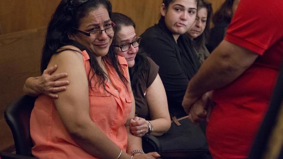 
Family members of Christian Salazar including his mother Wendy Jaramillo, left, aunt,Cecilia Jaramillo, friend, Suzannah Charles, and aunt, Miriam Roggiero, far right, wait to give a hug of support to Brandon Kyle Lapeikis after he pleaded guilty to manslaughter in the shooting death of her son. Lapeikis accidentally killed his buddy accidentally while playing a Russian roulette-style game with a gun.
