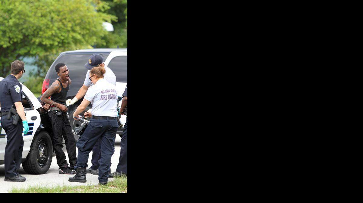 
Police work the scene of a shooting on Monday in the area of of Northeast 159th Street and 12th Avenue.


