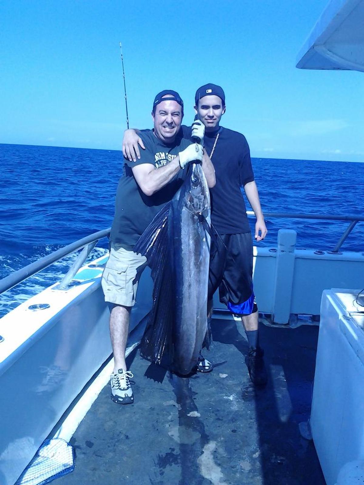 Sebastian Gregory, 16, right, and his father Andres Gregory on a fishing expedition the day before Miami-Dade police officer Luis M. Perez confronted Sebastian on a sidewalk in The Hammocks and shot him six times.
