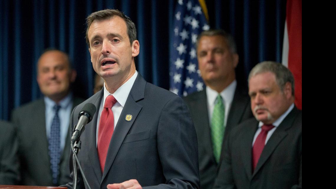
U.S. Attorney for the Southern District of Florida, Wifredo Ferrer, foreground, gestures as he speaks during a news conference announcing the results of an operation by the South Florida Identity Theft Tax Fraud Strike Force, against identity theft refund schemes, Thursday, April 9, 2015, in Miami. Federal investigators say 42 people in South Florida have been charged with identity theft and fraud that involved intended losses of $21 million. 
