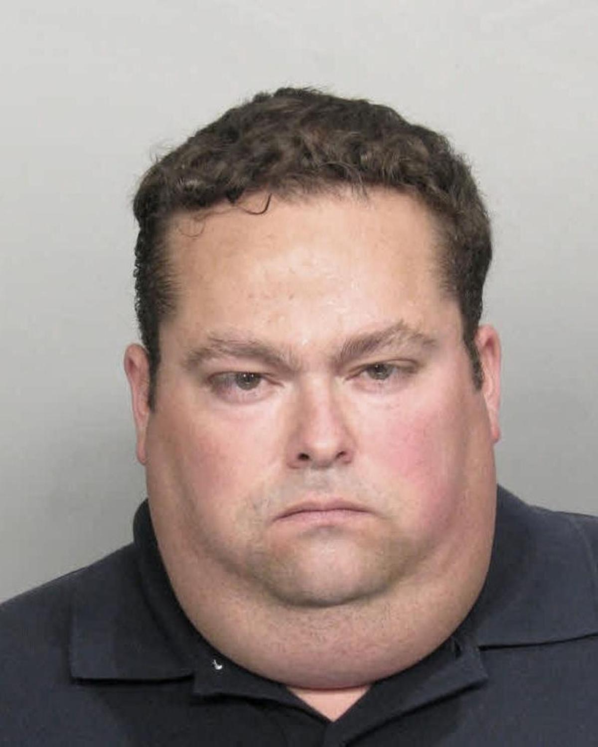 Jorge Antonio Espinosa, the former Miami-Dade police officer who was later charged with insurance fraud. His father is accused of trying to arrange the murder of a prosecutor.