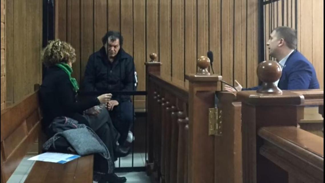 Giuseppe Donaldo Nicosia (center) was arrested on April 18 in the Ukrainian city of Odessa. He is wanted in Italy for allegedly masterminding a massive tax fraud.
