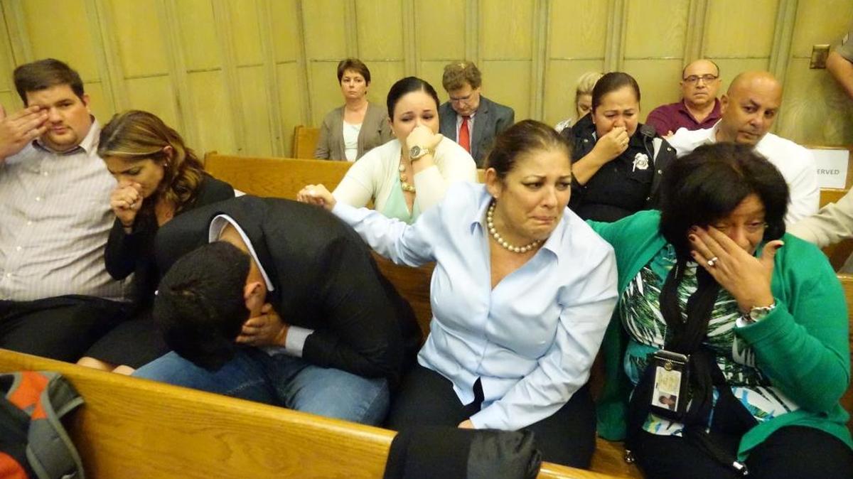 Maricel Yee, (center) the widow of slain ex-Miami police captain Robert Yee, and her family reacts to the guilty verdict of the man accused of his murder.