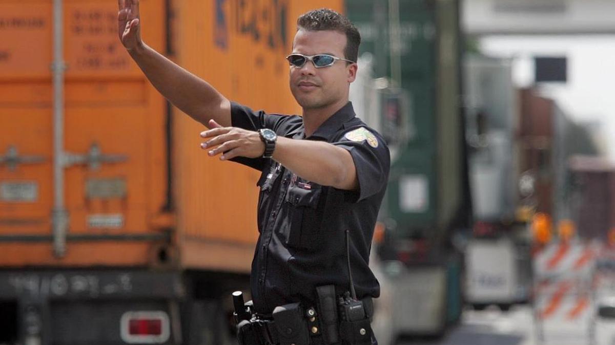 Miami Police Officer Dermis Hernandez, accused of running a Ponzi scheme, appeared in federal court on Friday.