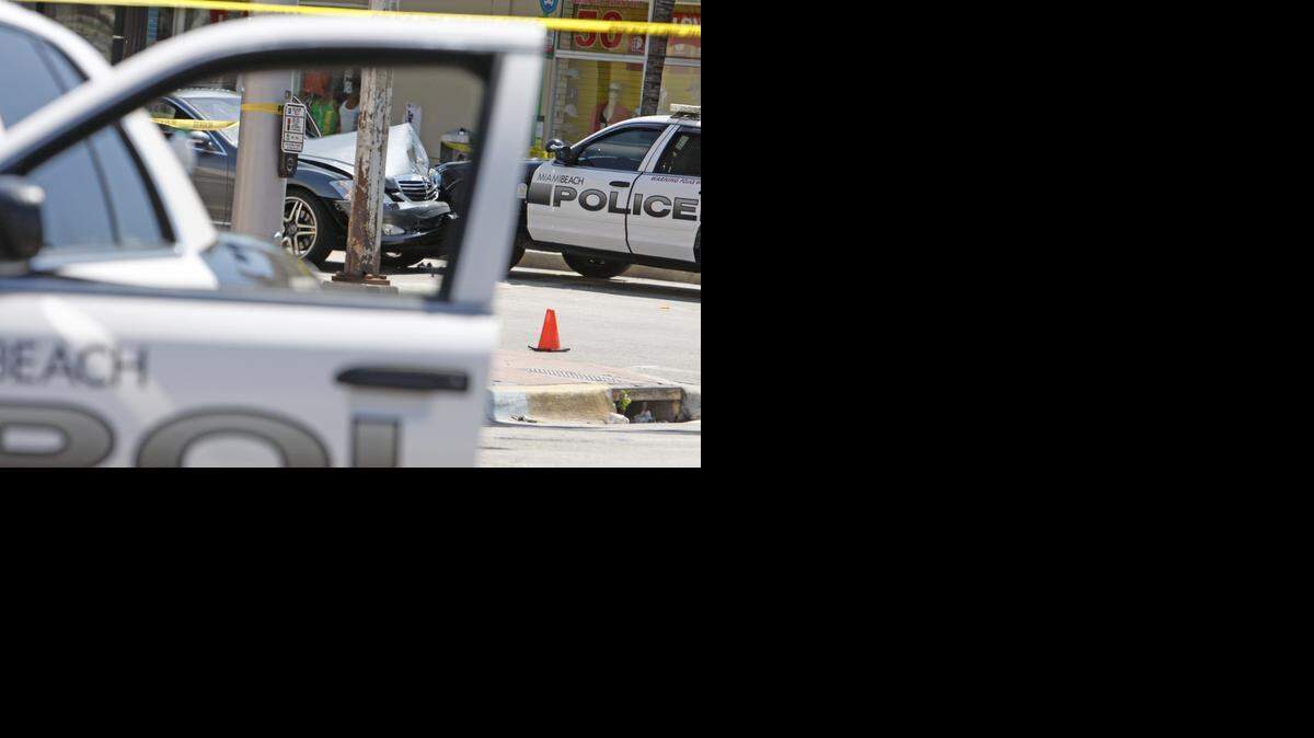 
In this 2011 file photo, Miami Beach police investigate a police-involved shooting Memorial Day weekend. 

