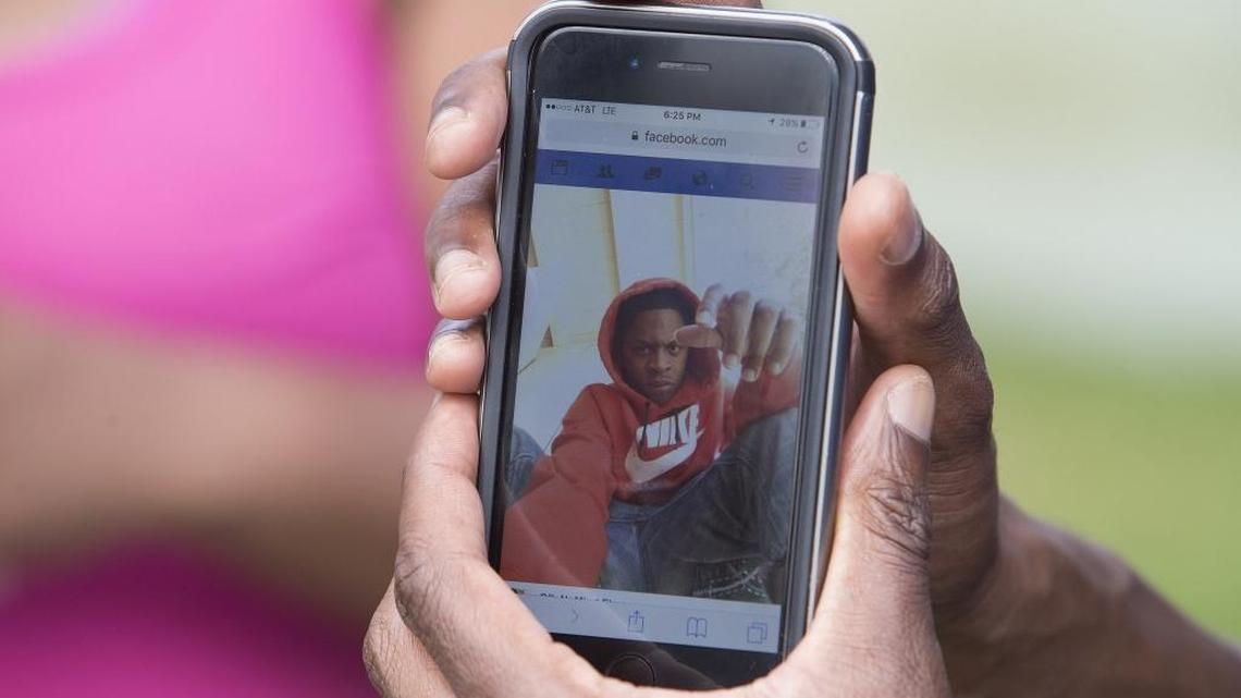Kentrill William Carraway, 22, pictured on phone, was shot and killed by a Miami-Dade police officer on Thursday, May 19, 2016. The shooting took place around Northwest 76th Street and 20th Avenue.