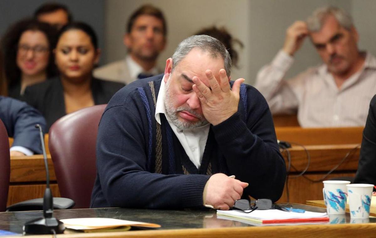 Rafael Andres, convicted of murdering waitress, Yvette Fariñas, in 2005, wipes away tears during the death penalty phase of his trial, on Monday, Dec. 16, 2014, in Judge Dava Tunis' courtroom.