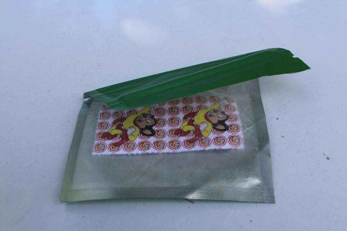 Illegal forms of LSD are often sold in sheets of tabs like this wound found by police during a raid several years of a suspected drug dealer’s home in Northwest Miami-Dade.