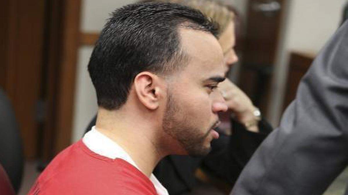 
Ronald Salazar reacts to his re-sentencing as one of his attorneys, Herb Smith, pats his arm on Friday, Feb. 6, 2015. Judge Ellen Sue Venzer re-sentenced Salazar to 40 years in prison, with a chance for a judicial review of his sentence in 25 years. Salazar, now 24, raped and murdered his sister in 2005.
