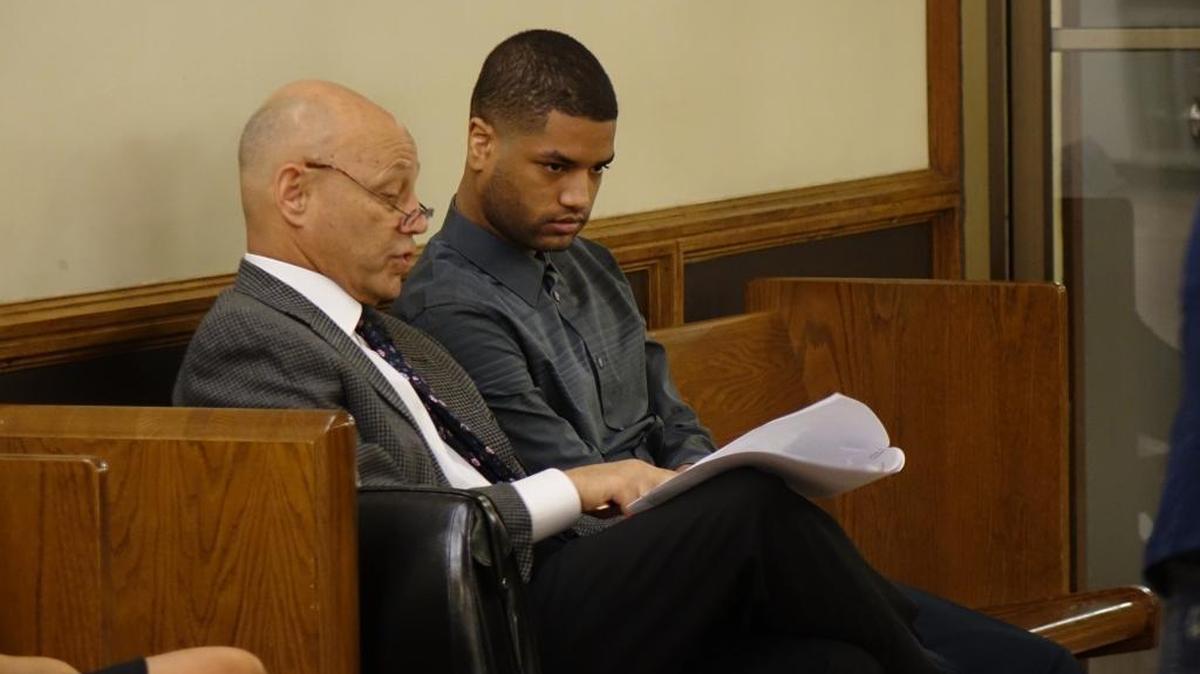 
Johann Ruiz, seated with lawyer, Neil Taylor, pleaded guilty Thursday in connection with the drug deal that killed the teen son of a Canadian diplomat in Miami.
