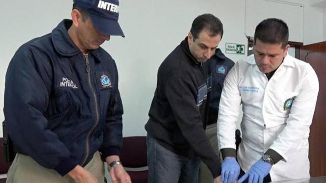 Nidal Waked Hatum is fingerprinted in Colombia before being extradited to Miami.