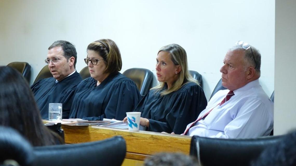 From left to right, Miami-Dade County judges Robin Faber, Maria Ortiz, Andrea Ricker-Wolfson and Edward Newman earlier this month listen to arguments about the constitutionality of a Florida law governing threats against police officers.