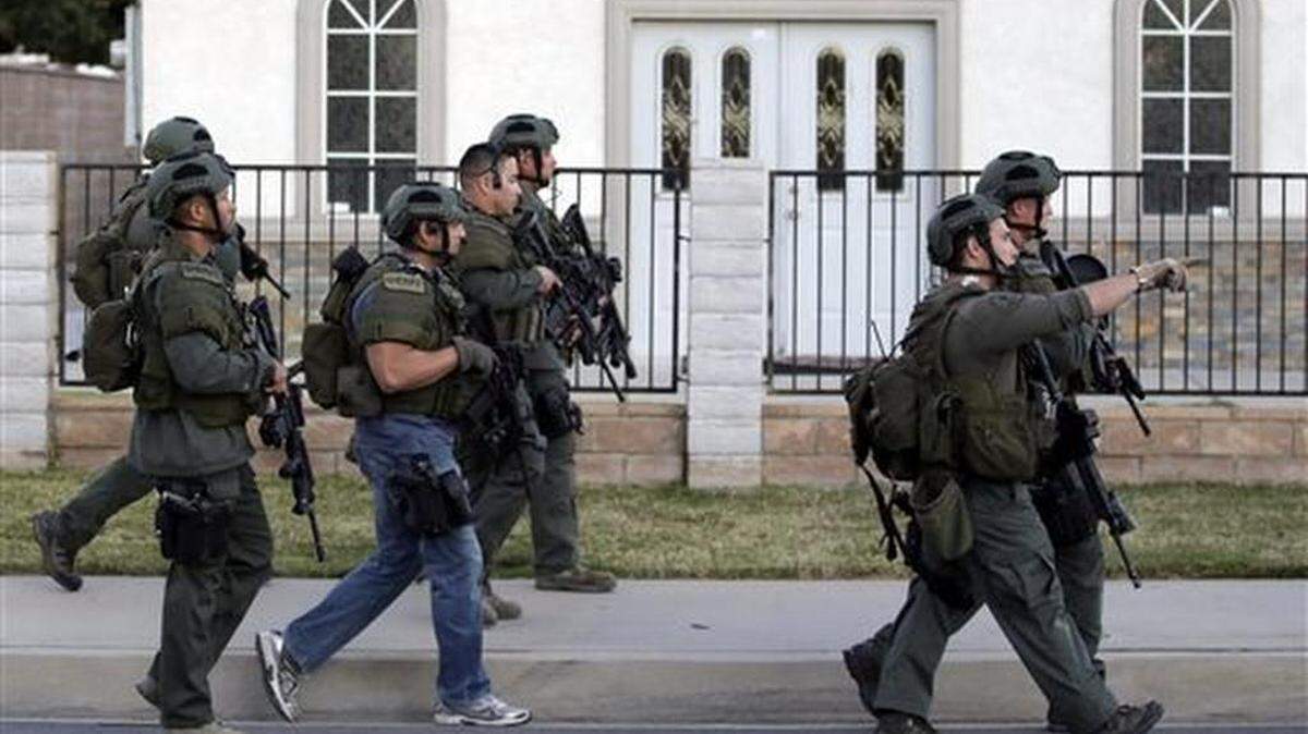 Authorities search for a suspect following a shooting that killed multiple people at a social services facility Wednesday, Dec. 2, 2015, in San Bernardino, Calif.