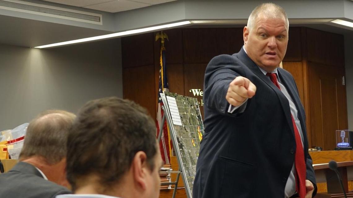 Miami-Dade prosecutor Joseph Mansfield points at defendant John Paul Garcia, who is standing trial for the murder of his mistress, Larissa Macriello. The woman’s body has never been found, and she is assumed dead.