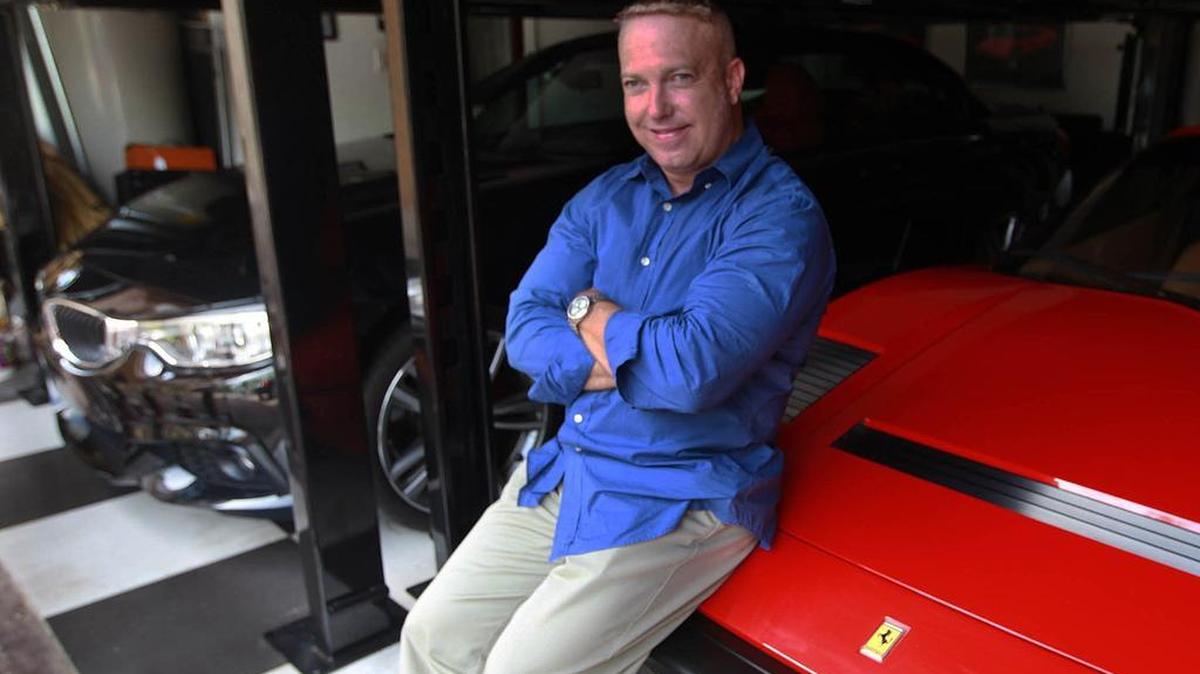 Miami-Dade Police Sgt. Emil Van Lugo in the garage of his West Kendall home. He was convicted of stealing taxpayer gas to fuel up his wife's new BMW.