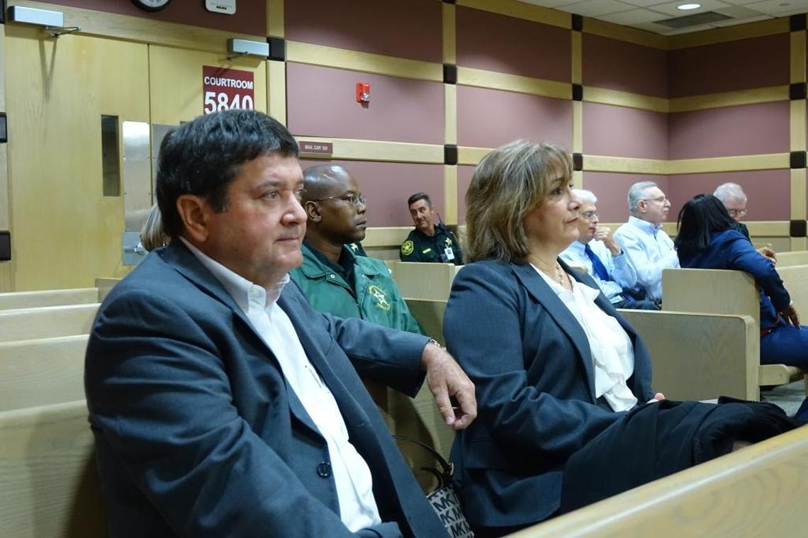 Broward judges Carlos Rodriguez, left, and Marina Garcia-Wood watch as former lawyer Jose Camacho was sentenced Thursday to 364 days in jail for forging judicial signatures, including theirs.