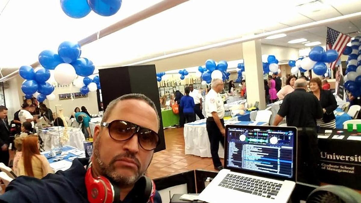 Alfredo Benitez, also known as DJ Freddy Benz, at a Miami Police health fair on Monday. Benitez was arrested on Wednesday by county police on suspicion of drug dealing.