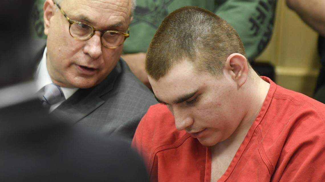 Special Assistant Public Defender David Frankel, left, talks with his client, Parkland school shooting suspect Nikolas Cruz, at a hearing in Broward Circuit Court.