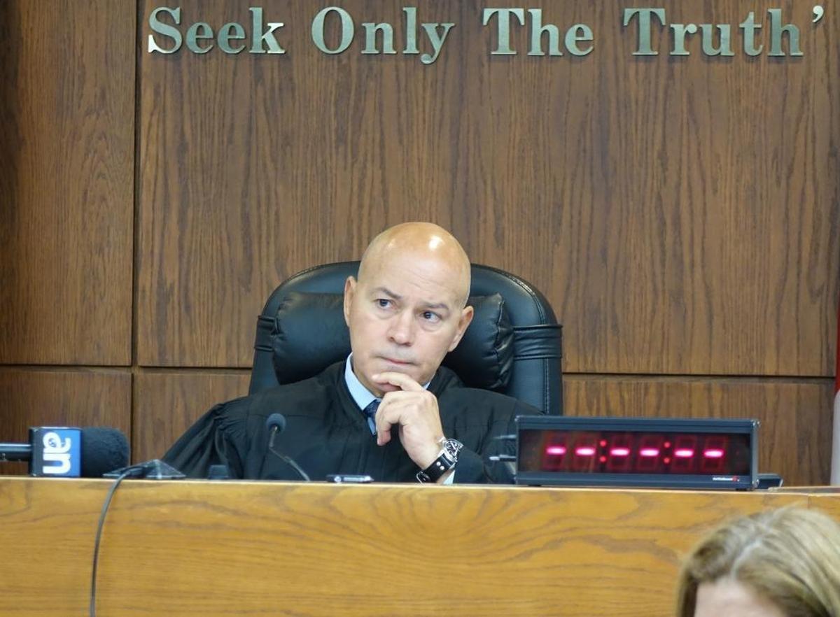 Miami-Dade Circuit Judge Alberto Milián listens to arguments Wednesday in the case of Gladys Coego, a 74-year-old woman who commited voter fraud. He sentenced her to two years of house arrest.