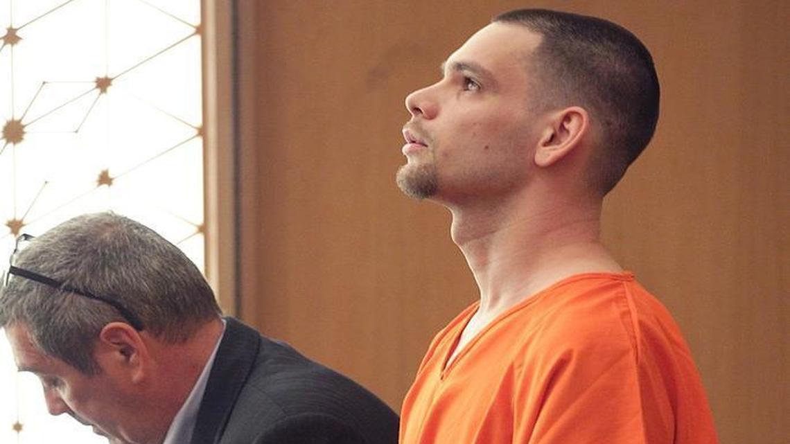 Court translator Peter Solymosi, left, translates Andras Vass’, right, appeal for forgivingness before he was sentenced to more than 11 years in prison for his role in a ring that used gay men from Hungary as sex slaves.