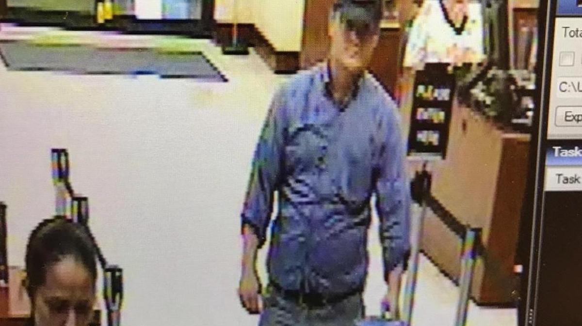The FBI is searching for the bank robber pictured in this surveillance video.