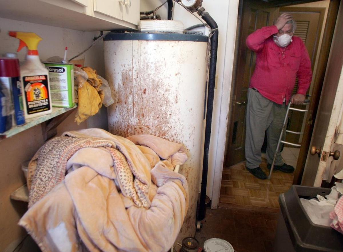 Citizens Property Insurance, a state-run company, represents hundreds of thousands of Florida businesses and homeowners. In this file photo, a North Miami homeowner shows water damage in a laundry room in 2006.