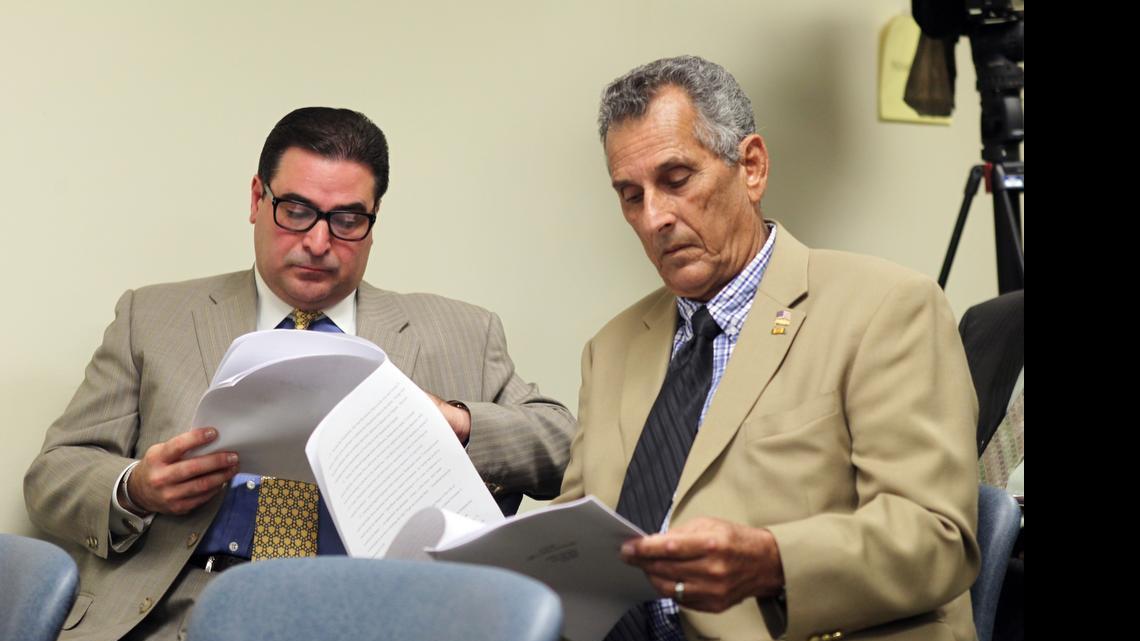 
Convicted Ponzi schemer Luis Felipe Perez, left, and former Hialeah Mayor Julio Martinez during an ethics hearing into statements that current Hialeah Mayor Carlos Hernandez made about his high-interest loans to Perez. The ethics panel fined Hernandez $3,000.
