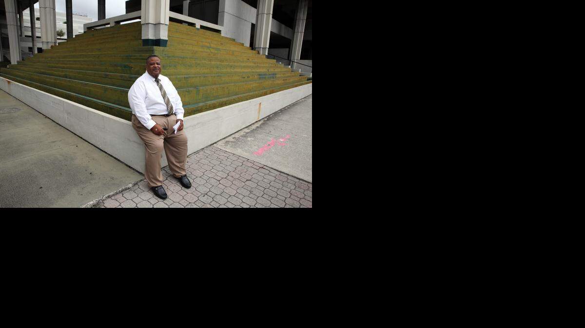 
Freddie Howard outside of the Federal Courthouse in Fort Lauderdale after pleading guilty to ID theft and tax fraud charges last summer. 
