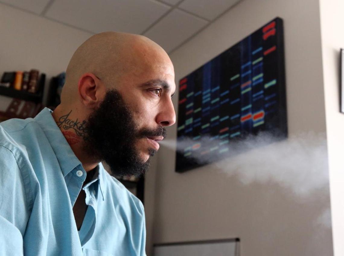 Miguel Valdes, 34, a convicted killer who is on probation, was recently allowed to use medical marijuana to deal with his schizophrenia. Valdes exhales the medical marijuana after using a vape device at his attorney’s office Friday morning, Nov. 10, 2017.