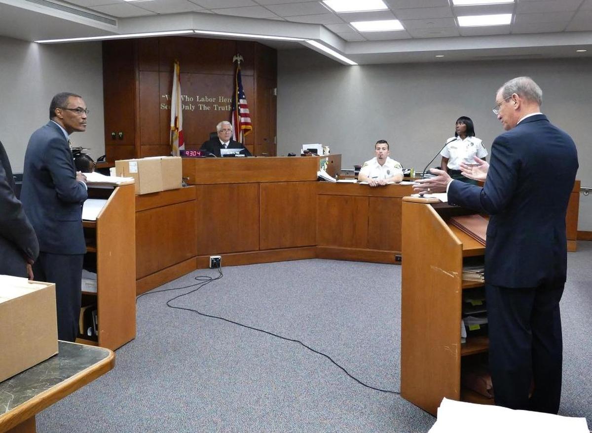 Don L. Horn, Chief Assistant State Attorney, left, listens to Douglas C. Hartman, Defense Attorney for North Miami Police Officer Jonathan Aledda, as the prosecution upgrades charges against the cop in the Charles Kinsey shooting, on Friday, May 12, 2017 as Judge Alan S. Fine presides over the case.