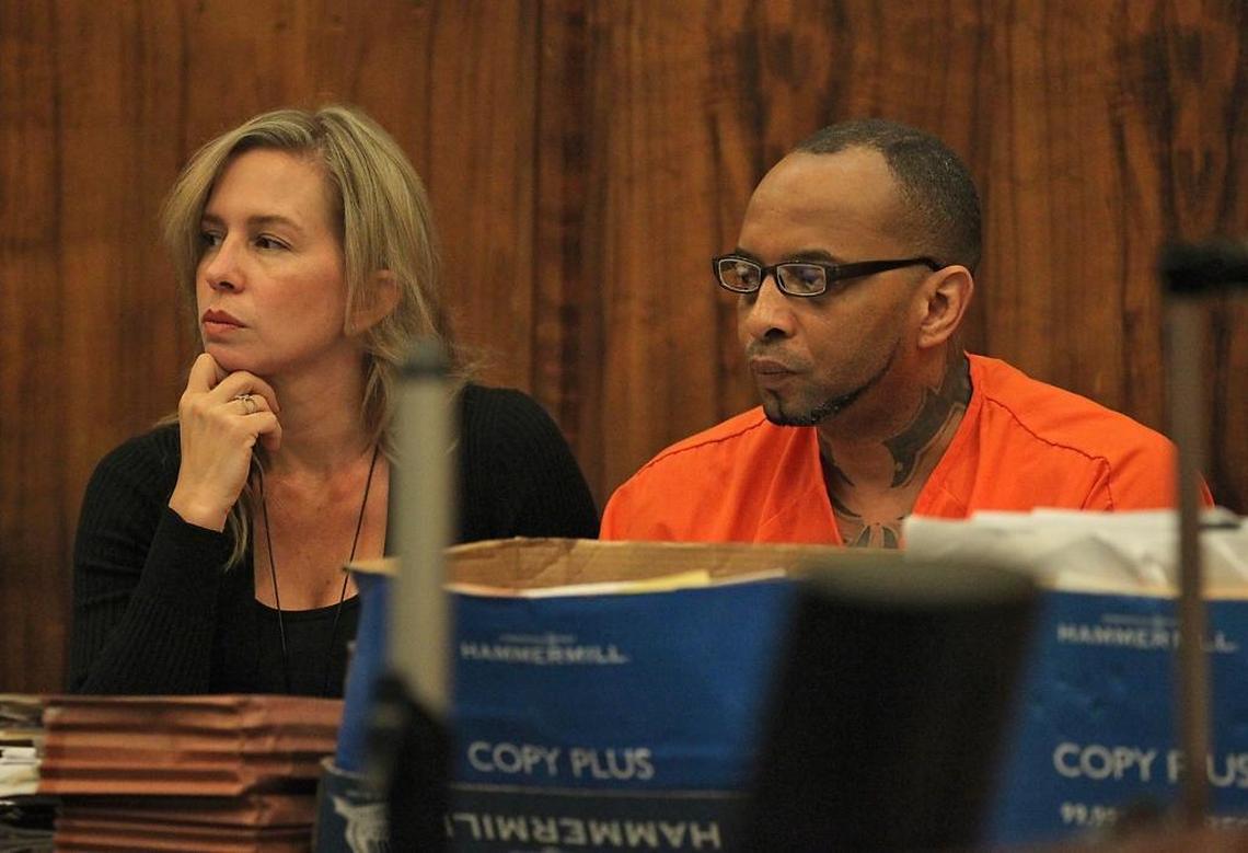 Nakia Huggins sits alongside his attorney Michelle Estlund as they listen to testimony in Judge Victoria Del Pino's courtroom for his re-sentencing hearing.