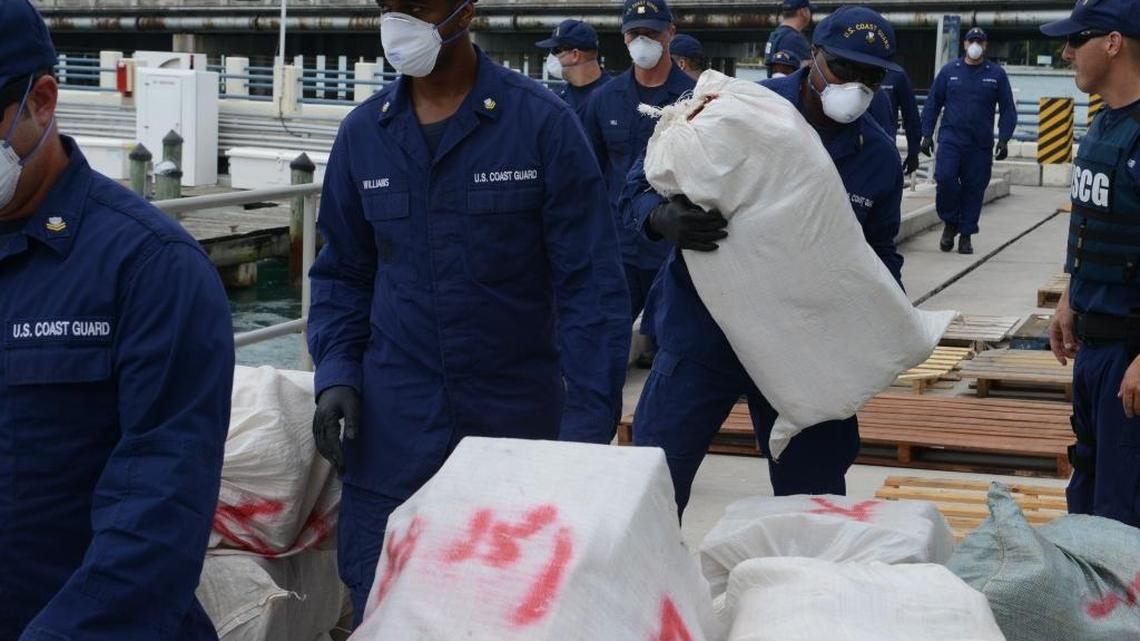 
Coast Guardsmen offload bales of cocaine and marijuana at Coast Guard Base Miami Beach, Fla., Sept. 29, 2015. The drugs were seized in three separate interdictions in the Caribbean Sea.
