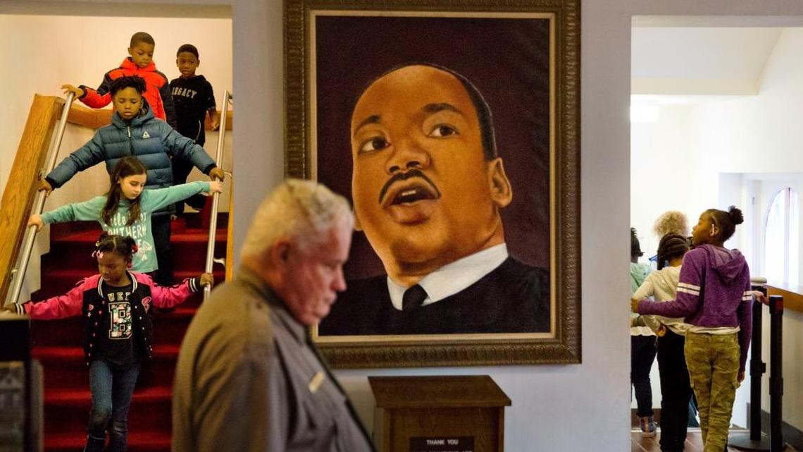 A portrait of Dr. Martin Luther King Jr. in Ebenezer Baptist Church where King preached, as school children tour the historic building during an event celebrating the birthday of the slain civil rights icon in Atlanta, Friday, Jan. 12, 2018. A federal holiday to commemorate his birthday is observed Monday.