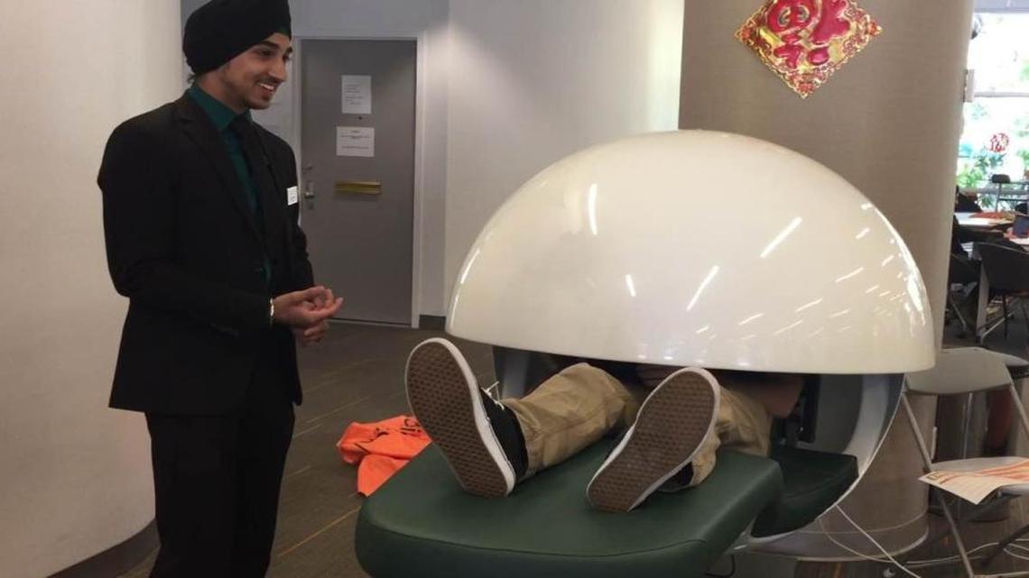Ish Singh, above, a University of Miami senior and student government vice president, unveiled a 'napping pod' purchased last year to help students relax.