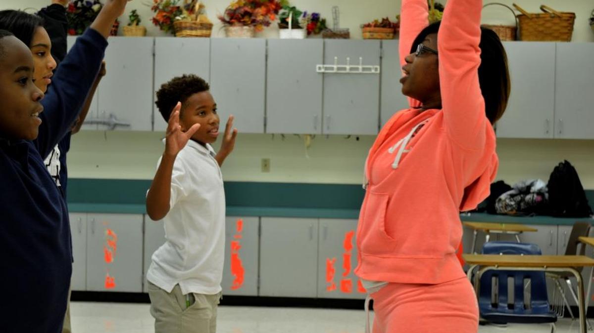 Tanisha Cidel, right, teaches students in the theater magnet program at Norland Middle School.