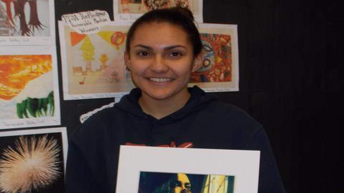 
WINNING PHOTOGRAPH: Yesenia Garcia of Hammocks Middle School holds her winning photographic entry from the 2015 Scholastic Regional Competition. The photograph will be displayed at the Rubell Family Collection Exhibit.
