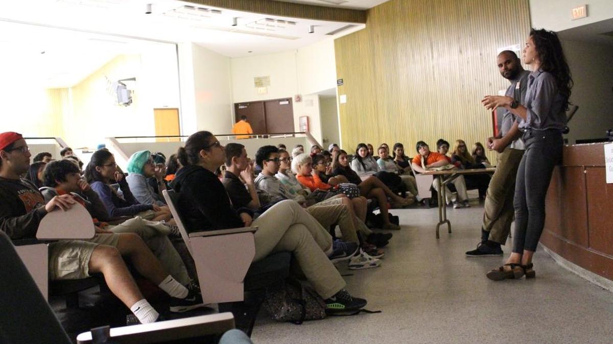 Natalia Lassalle, a local filmmaker, and Ronald Baez of the Miami Film Development Project speak to students at South Miami Senior High School on Wednesday, Dec.16.