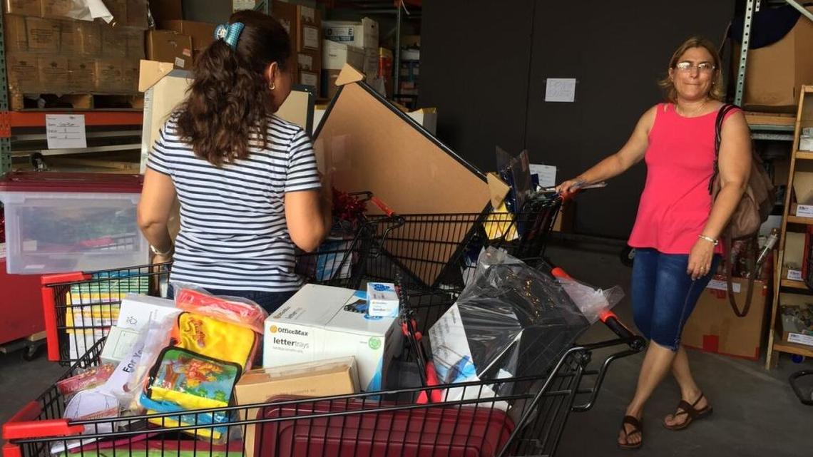 Teachers fill up their carts with school supplies at The Education Fund’s Ocean Bank Center for Educational Materials, a free school supply warehouse for teachers.